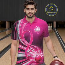 Load image into Gallery viewer, Male model wearing a pink bowling polo with breast cancer awareness ribbons and bowling graphics, front view at the bowling lane