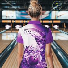 Load image into Gallery viewer, Female model wearing a purple bowling quarter zip with butterfly graphics and bowling artwork, back view at the bowling lane