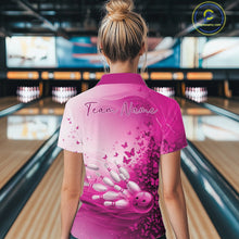 Load image into Gallery viewer, Back view of a female model in a white and pink bowling quarter zip with butterfly artwork and colorful bowling graphics