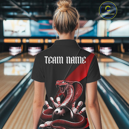 Back view of a black womens bowling polo displaying a red cobra wrapped around a bowling ball with scattered pins.