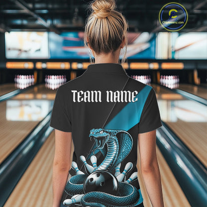 Back view of a black womens bowling polo showcasing a blue cobra around a bowling ball with scattered pins.