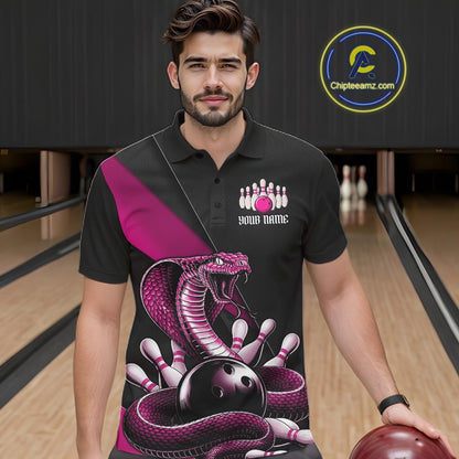 Male model in a bowling center wearing a black bowling polo with pink cobra artwork and bowling pin accents.