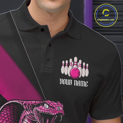 Close-up left chest graphic on a black bowling polo featuring a pink cobra and bowling ball motif.