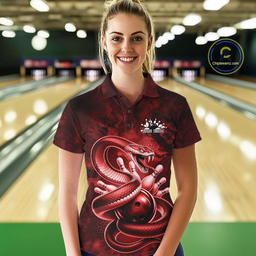 Female model at a bowling alley wearing a bowling polo with red cobra artwork and bowling-themed graphics.