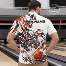 Load image into Gallery viewer, Male model inside a bowling center wearing a white bowling quarter-zip shirt with orange and black tribal graphics and a red bowling ball striking pins