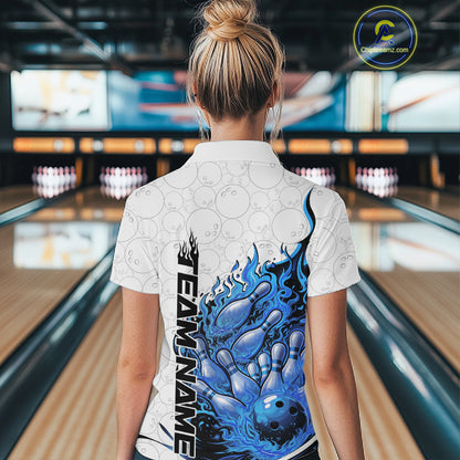 Back view female model in bowling lane wearing polo shirt with flaming bowling ball crashing into pins blue dynamic fire bowling design
