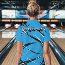 Load image into Gallery viewer, Back view of a female bowler in a bowling alley wearing a blue, black, and white bowling polo shirt with an athletic jersey pattern