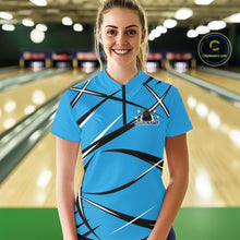 Load image into Gallery viewer, Front view of a female bowler wearing a blue, black, and white bowling quarter-zip shirt in a bowling lane