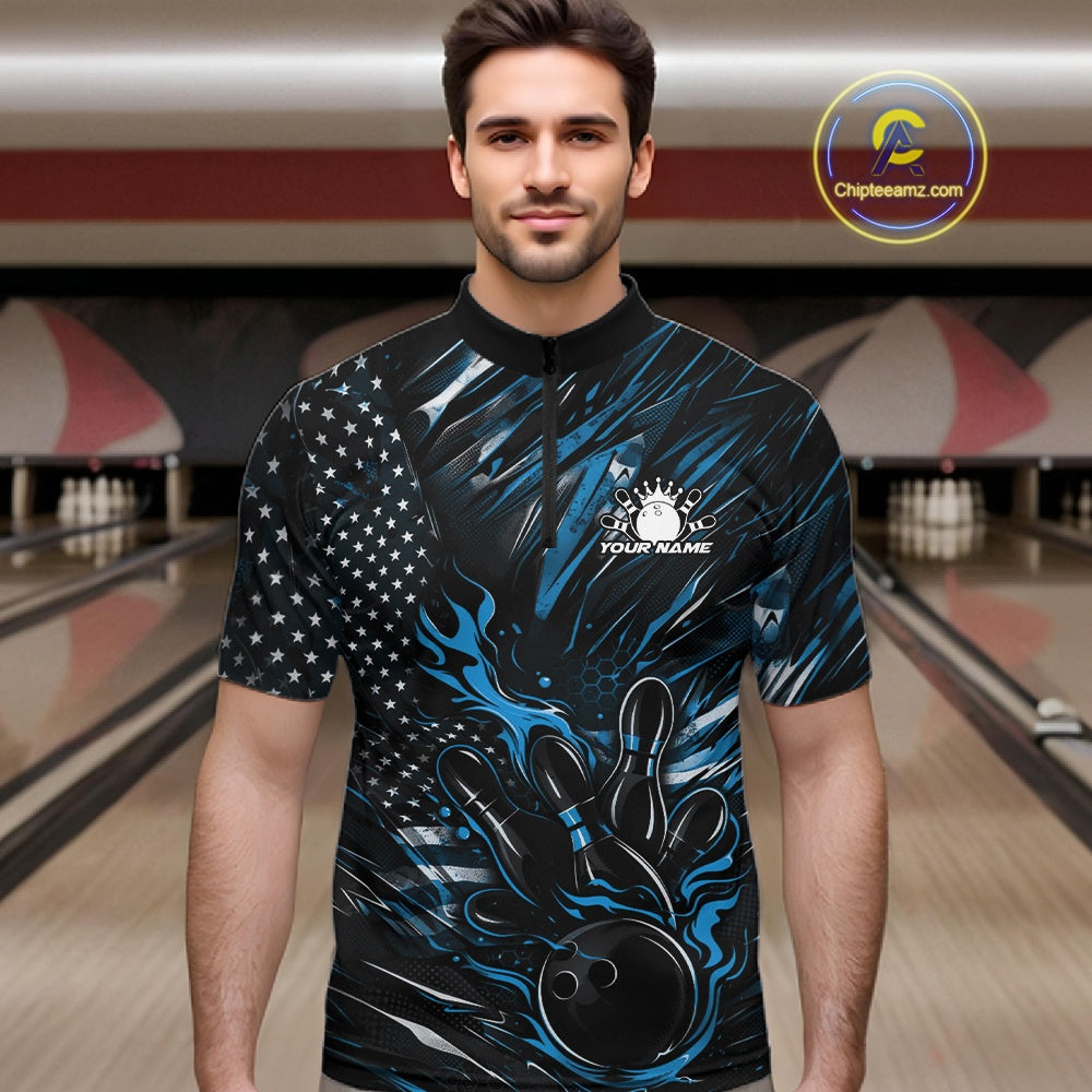 Male model wearing a black and blue bowling quarter-zip shirt at a bowling lane with fiery bowling action graphics and patriotic details.