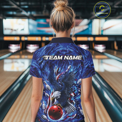 Female model back view in a bowling lane wearing a bowling quarter zip shirt with eagle artwork, bowling ball, flag elements, and pins.