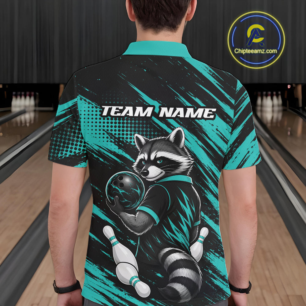 A person standing in a bowling alley wearing a short-sleeve polo shirt shown from the back. The shirt has a black and teal graphic design with a raccoon holding a bowling ball and pins, plus the text 'TEAM NAME' across the upper back.