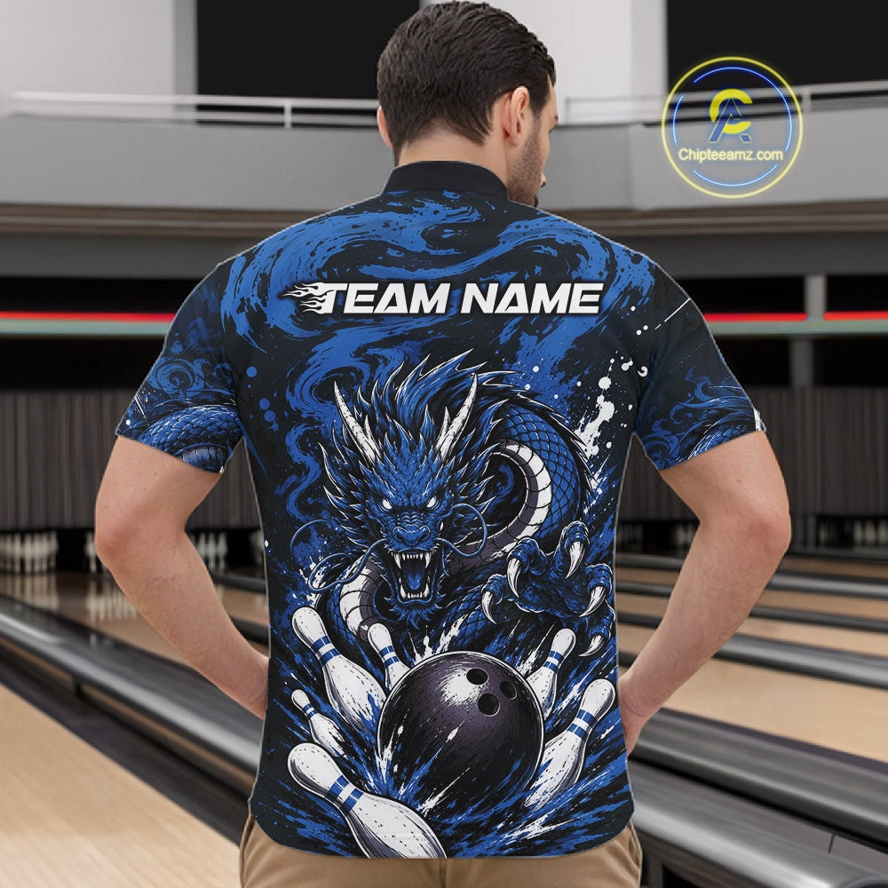 Man wearing a blue dragon-themed bowling shirt with 'Team Name' text at a bowling alley.
