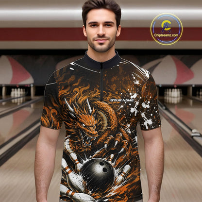 Man wearing a bowling shirt with a dragon design in a bowling alley.