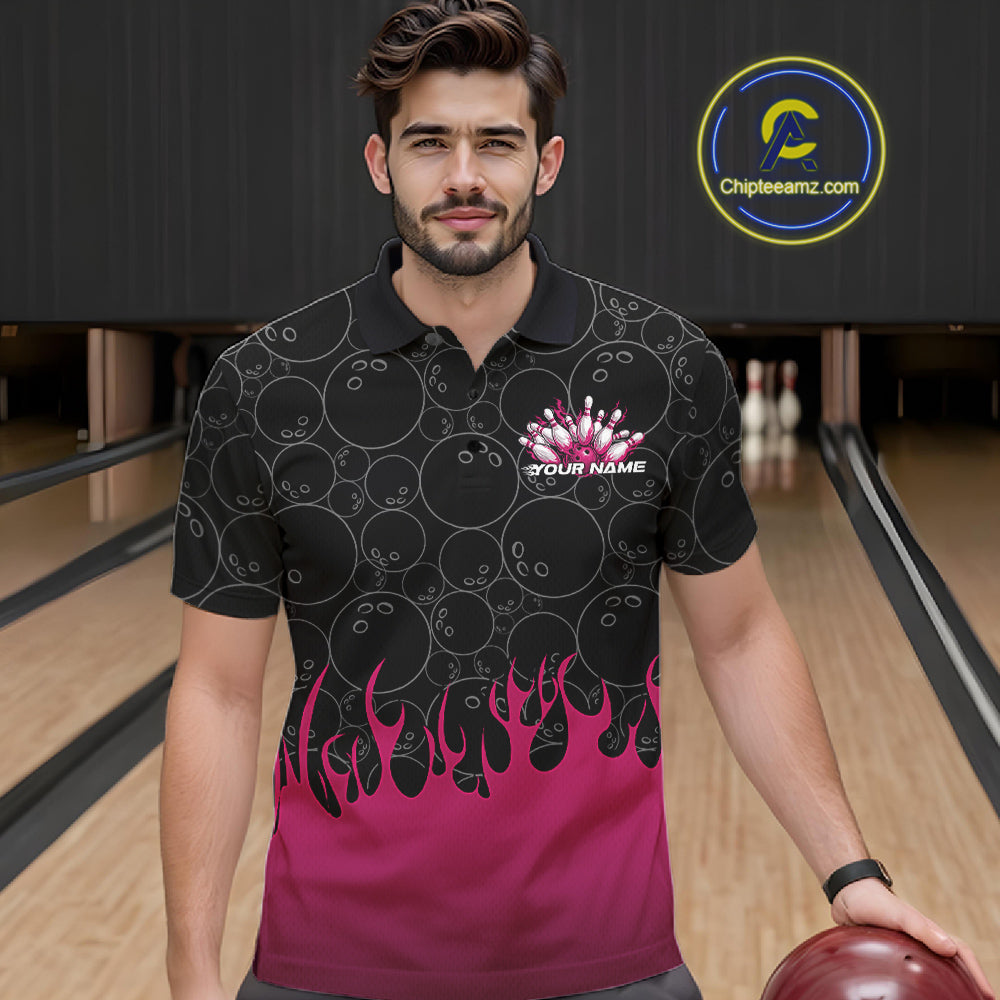 Front view of a male model in a bowling lane wearing a black polo shirt with vibrant pink flames and bowling ball pattern with dynamic bowling strike visuals.