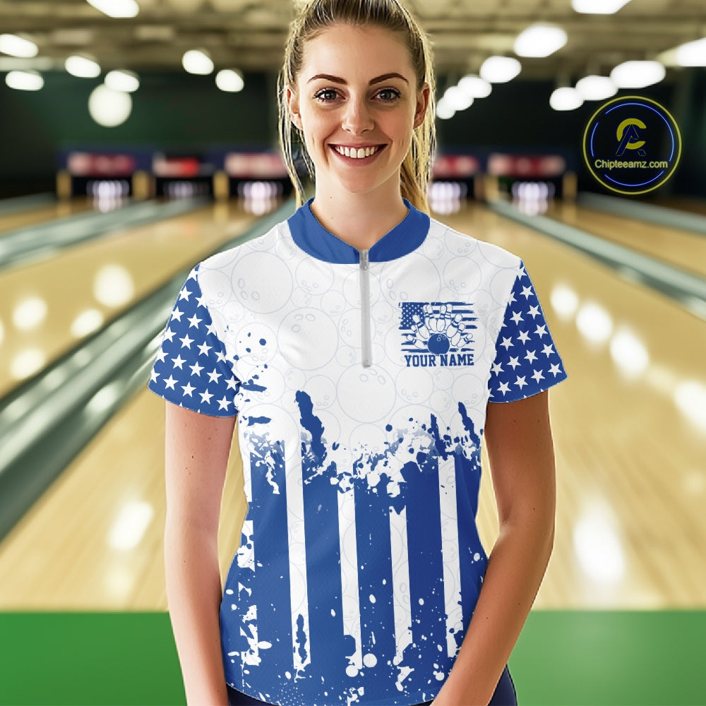 Female bowling team matching in personalized blue patriotic US flag quarter-zip jerseys at the lanes.