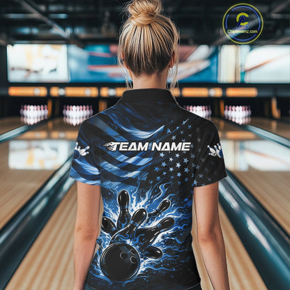 Back view of a female model in a black bowling polo shirt showcasing blue flame bowling strike artwork and distressed flag motifs.