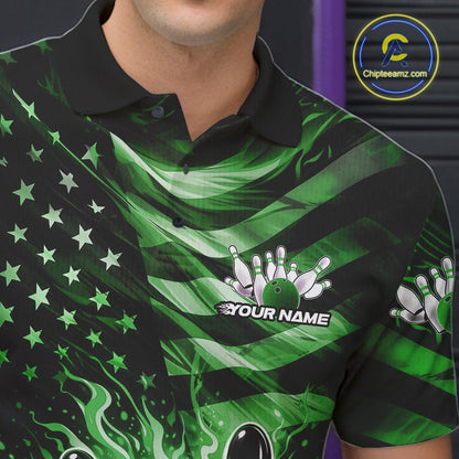 Left chest close-up of a black bowling polo shirt displaying green flame bowling artwork and flag-themed details.