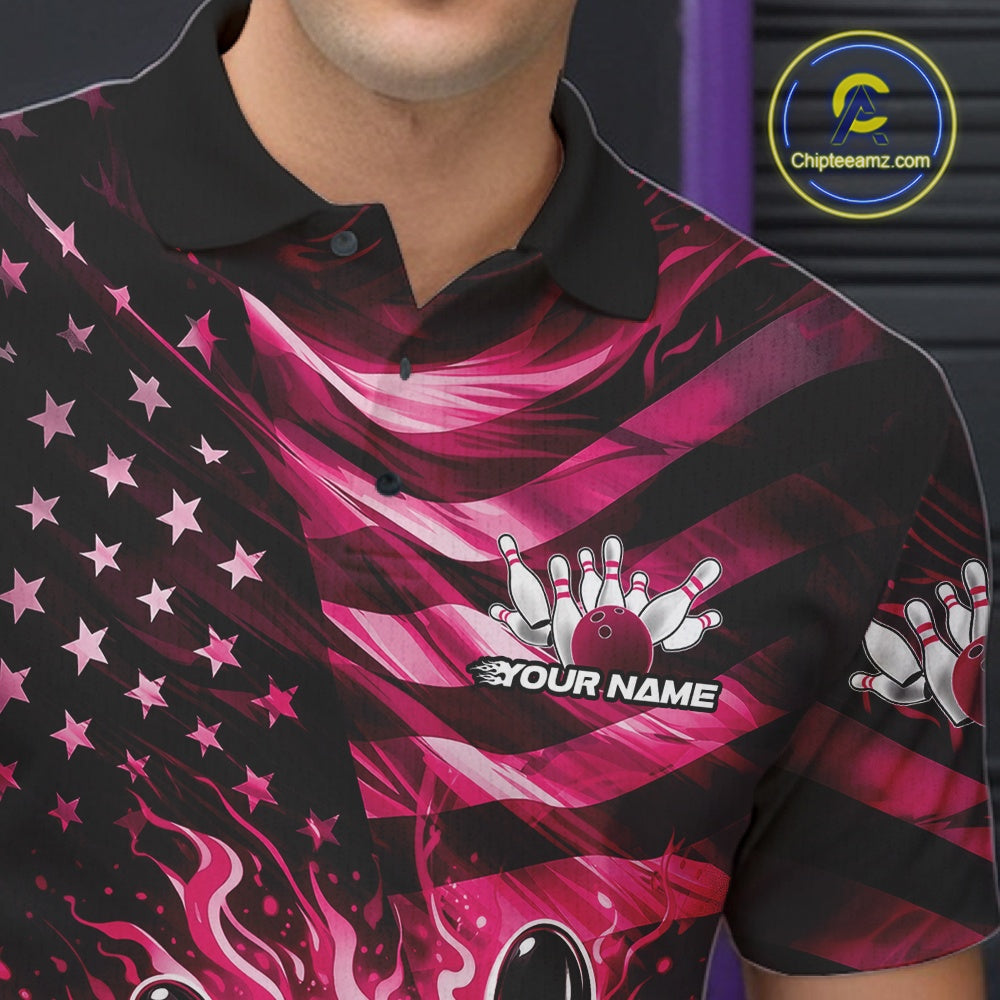 Left chest close-up of a black bowling polo shirt featuring pink flame bowling artwork and flag-themed accents.