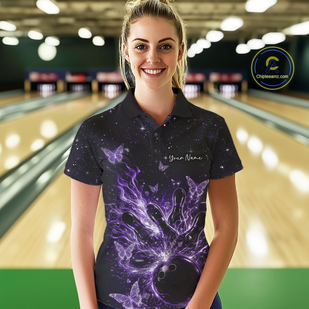 Female model in a black and purple bowling polo shirt at the lane with cosmic flaming strike artwork.