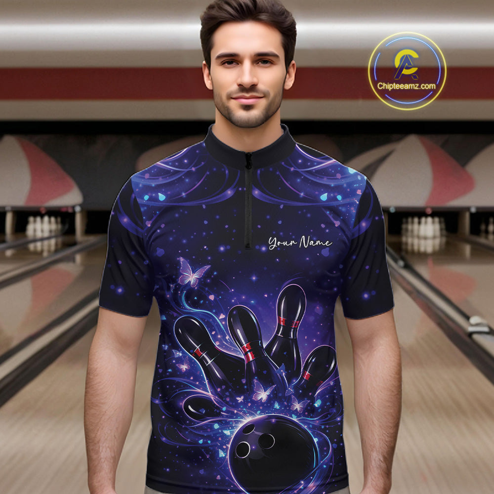Male model in a blue and purple bowling quarter-zip shirt at the lane with glowing butterfly graphics.