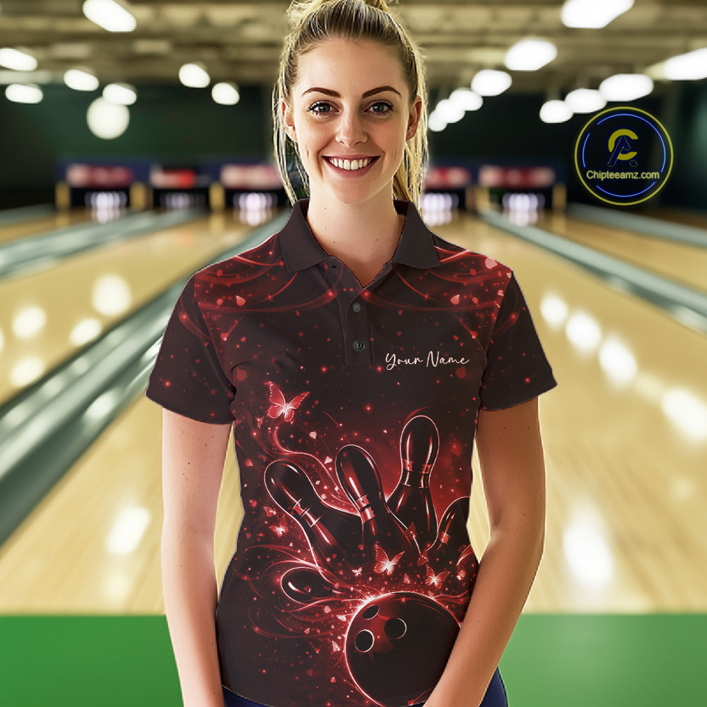 Female model in a black and red bowling polo shirt at the lane with luminous butterfly bowling motifs.