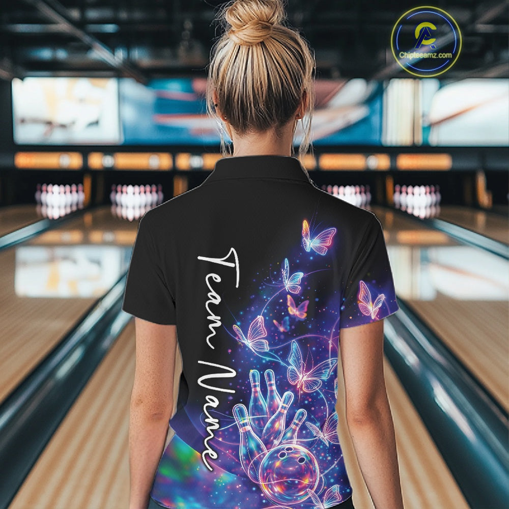 Back view of a female model wearing a black bowling polo with starry galaxy graphics, glowing neon swirls, and hologram butterflies