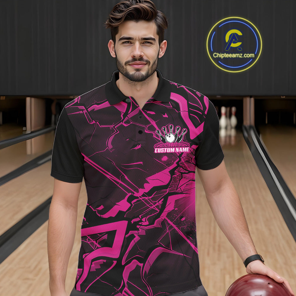 Male model wearing a bowling polo in a bowling alley with black and pink futuristic geometric graphics.