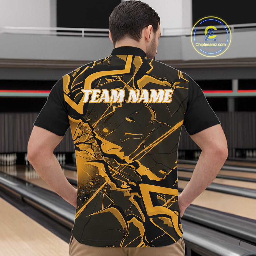 Front view of a mens black and yellow quarter-zip showcasing sharp angular lines and cracked pattern artwork.