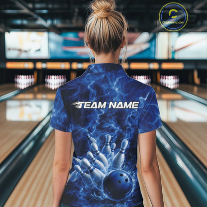 Back view of a womens bowling polo displaying a blue bowling ball striking pins with flame-inspired details.