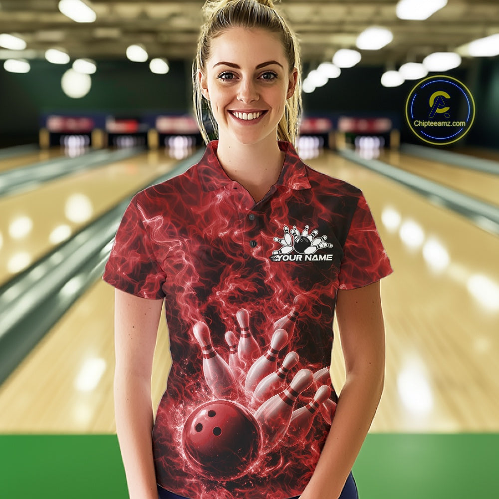 Female model wearing a bowling polo at the bowling lane with red bowling ball strike artwork and flame accents.