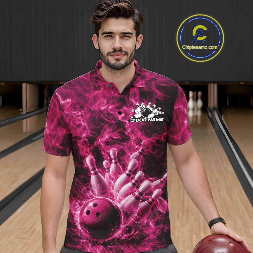 Male model wearing a bowling polo in a bowling alley with pink bowling ball strike artwork and fiery graphics.