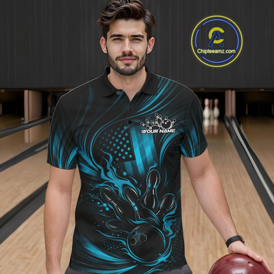 Male model at a bowling lane wearing a black and turquoise blue polo shirt with patriotic bowling strike graphics and flame accents.