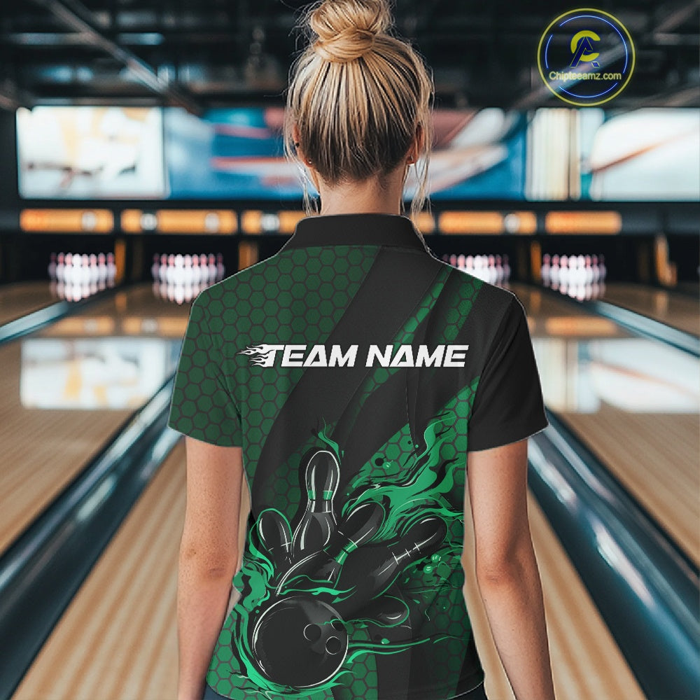 Back view of a female model in a bowling venue wearing a black and green polo shirt showcasing a bowling strike design with hexagonal accents.