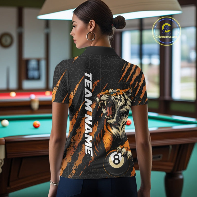 Back view female model wearing a Billiard polo shirt with roaring tiger artwork and orange claw mark accents.