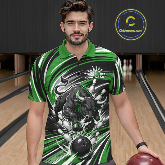 A man wearing a green and black bowling-themed graphic polo shirt, standing in a bowling alley holding a bowling ball. The shirt features a bold bull graphic, bowling pins, and a bowling ball illustration.