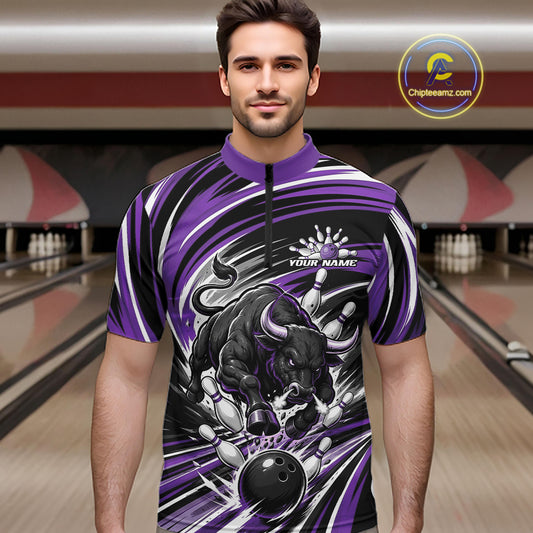 A man wearing a purple and black bowling-themed quarter-zip shirt with a bull graphic, standing in a bowling alley. 