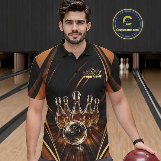 A man wearing a black and brown bowling-themed polo shirt with a gold crown and bowling pin graphics that resemble wine bottles, standing in a bowling alley holding a bowling ball.