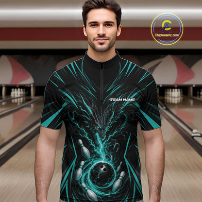 A man wearing a black short-sleeve bowling jersey with a teal and black dragon and bowling graphics, standing in front of a bowling alley background.