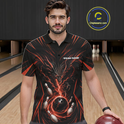 A man wearing a black short-sleeve bowling-themed polo shirt with a red and orange dragon graphic and bowling pins and ball design, standing in a bowling alley holding a bowling ball.