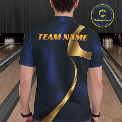A man viewed from behind wearing a dark navy blue bowling shirt with a metallic gold graphic design and 'TEAM NAME' printed across the upper back. Bowling lanes are visible in the background