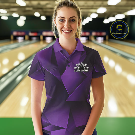 Woman wearing a purple bowling shirt with a logo in a bowling alley