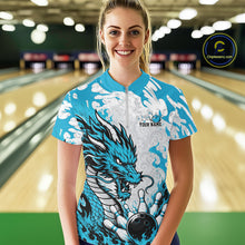 Load image into Gallery viewer, Woman wearing a blue and white dragon-themed bowling shirt in a bowling alley.