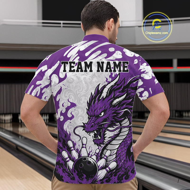 Person wearing a purple bowling shirt with a dragon design in a bowling alley.