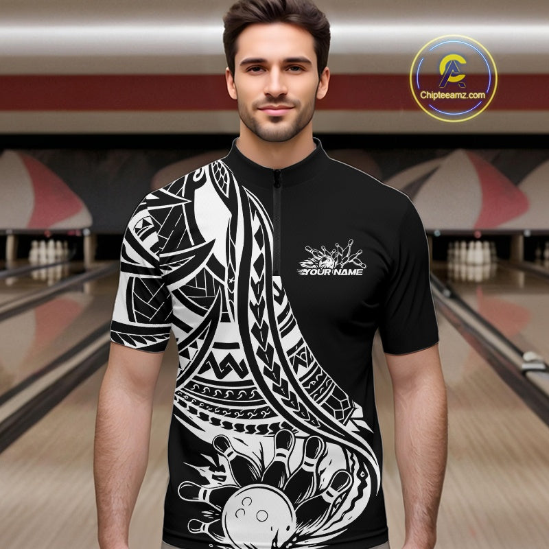 Man wearing a black and white tribal pattern bowling shirt with a design in a bowling alley.