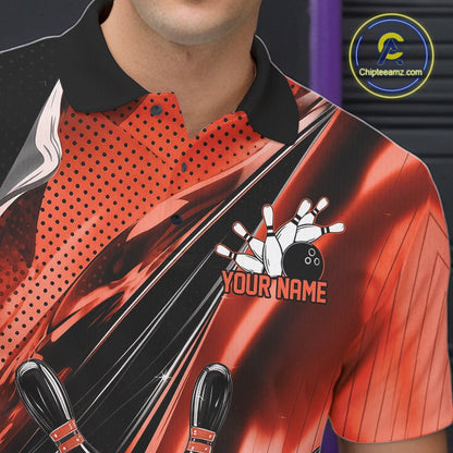 Close-up left chest detail of a black and orange bowling polo shirt featuring bowling strike artwork with speed streak accents.
