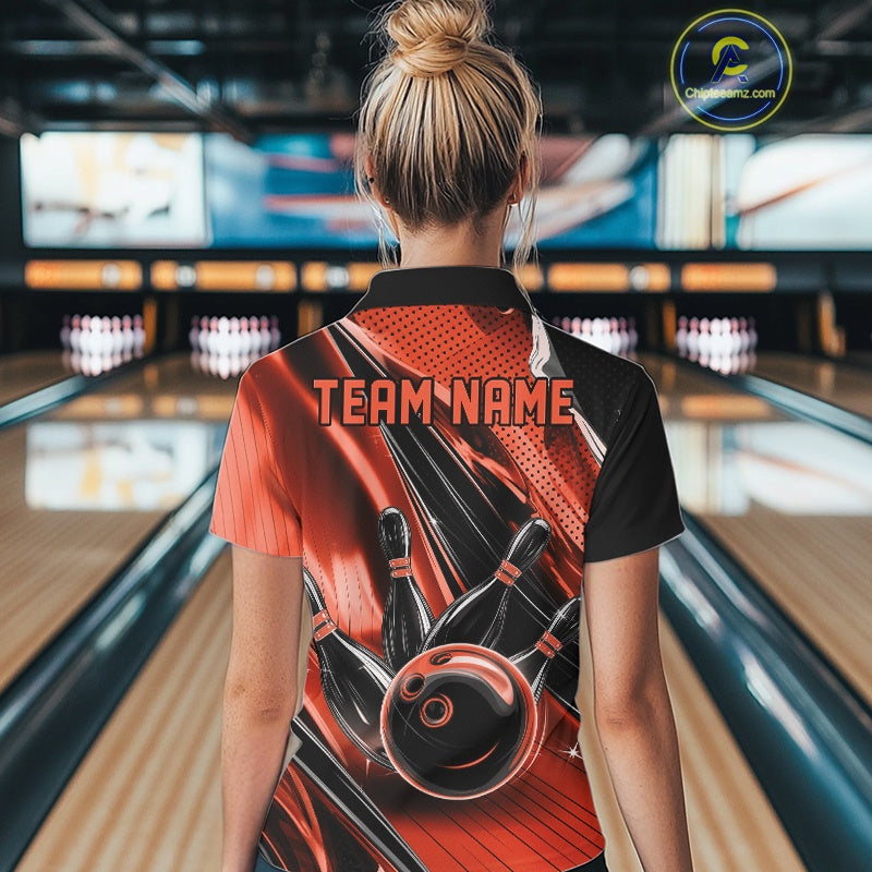 Back view of a female model in a black and orange bowling polo shirt displaying dynamic bowling strike graphics.