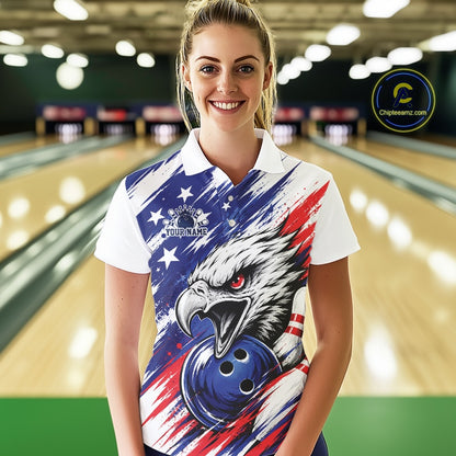 Woman wearing a bowling shirt with an eagle and American flag design in a bowling alley.