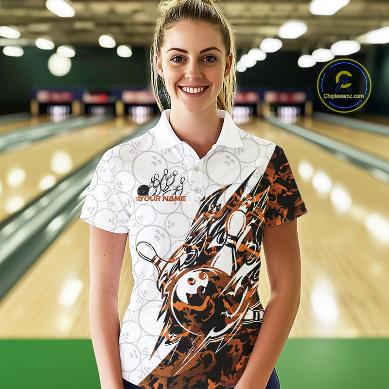 Female model wearing a white bowling polo shirt at the bowling lane with yellow camo bowling graphics and faint bowling ball patterns.