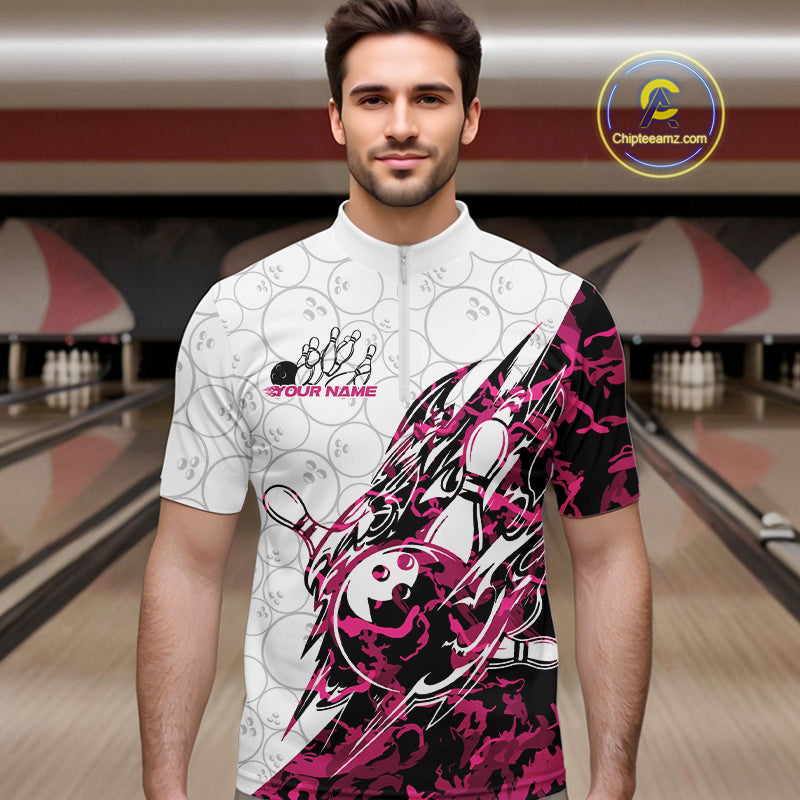 Male model wearing a white bowling quarter-zip shirt at the lane with pink camo-inspired bowling graphics and subtle bowling ball patterns.