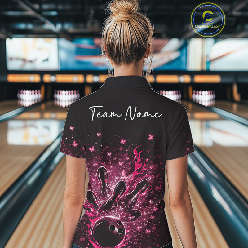 Back view of a female model in a black and pink bowling quarter-zip shirt with sparkling butterfly bowling artwork.
